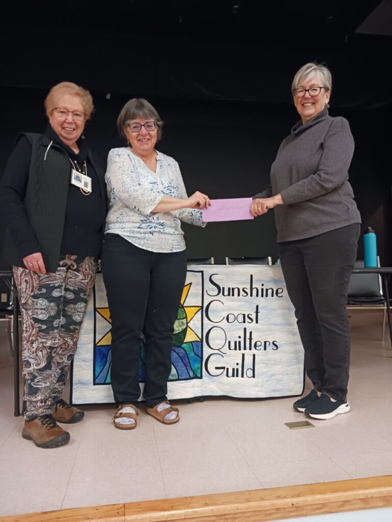 Charlene Krohman, Treasurer Sechelt Rotary Club presented SCQG executive members with another cheque - March 2023